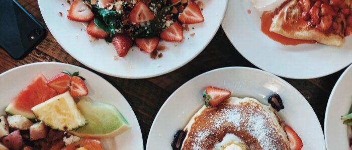 Strawberry crepe and spinach salad Strawberry spinach salad, strawberry crepe with whipped cream, eggs Benedict and pancakes at Crepes on Cole
